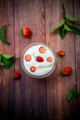 sweet homemade yogurt with red ripe fresh strawberries