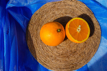 oranges on a blue background top view