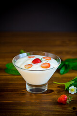 sweet homemade yogurt with red ripe fresh strawberries