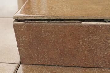 exfoliation of ceramic tiles, defect of a ceramic tile, destruction of ceramic tiles on the stairs