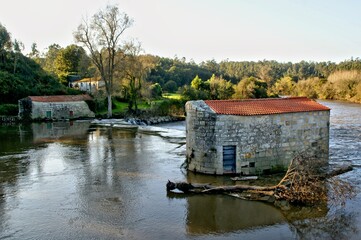 Fototapeta na wymiar Traditional watermills on the Ave river, Portugal