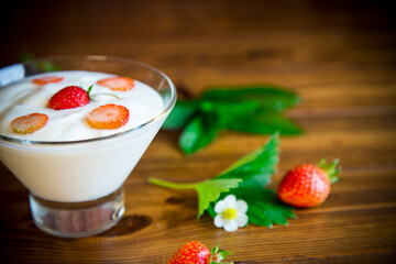 sweet homemade yogurt with red ripe fresh strawberries