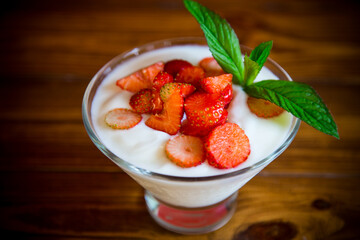 sweet homemade yogurt with red ripe fresh strawberries