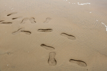 Fototapeta na wymiar footprints on the beach