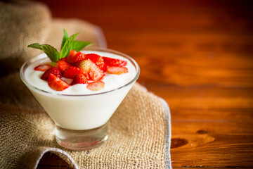 sweet homemade yogurt with red ripe fresh strawberries