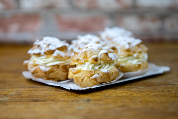 cream puffy in detail on wooden underground