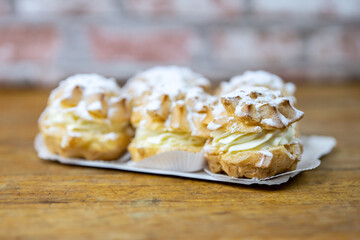 cream puffy in detail on wooden underground