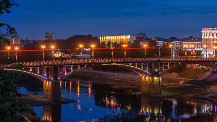 Fototapeta na wymiar View of the bridge over the Dvina river at night in Vitebsk