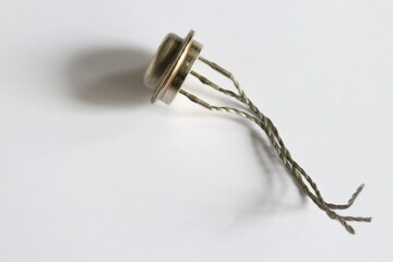 old electronic parts, large transistors on a white background