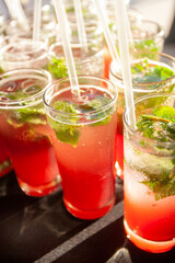 Special  strawberry mojito cocktails on a tray ready to serve at a cockail party