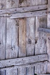 Background from old wooden boards. Old, gray boards fastened with rusty nails.