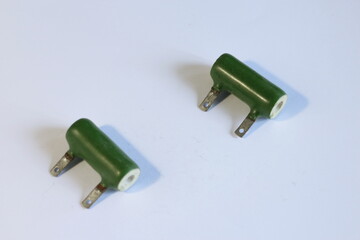 old electronic parts, capacitors on a white background