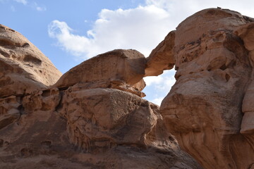 huge rock bridge with window to the sky shaped like a heart, Wadi Rum Desert, Jordan