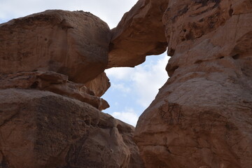 huge rock bridge with window to the sky shaped like a heart, Wadi Rum Desert, Jordan