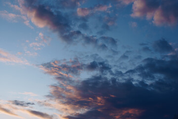 Clouds on the blue sky background during sunset