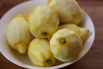 Naklejka na ściany i meble peeled Amalfi lemons in preparation of homemade Limoncello in white 