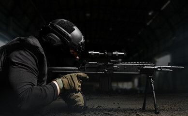 Sniper soldier in black uniform aiming rifle with scope on dark background.