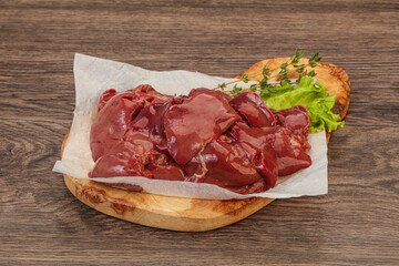Raw chicken liver over board