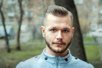 sport young man with a modern trendy fade haircut for barbershop