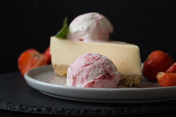  ice cream scoops with strawberry and mint decoration. Summer food concept with copy space.