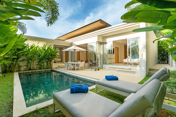 Interior and exterior design of luxury pool villa, house, home feature swimming pool, sunbed, blue...