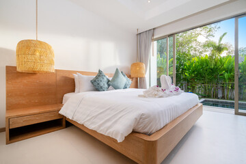Interior design of bedroom in luxury and modern style pool villa feature a pool view, green garden,...