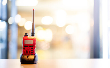 A red Walkie Talkie or Portable radio transceiver for communication.
