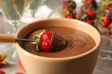 Strawberry in chocolate, close up. Chocolate fondue