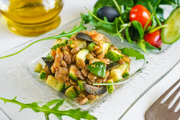 Vegan salad with avocado, vegetables and lentils is prepared for Breakfast at home. Diet food for forced inactivity. diet without calories