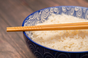 Bowl of rice with chopsticks
