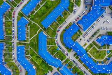 Aerial view of the housing estate with blue roofs. Estate Sloviki located on Witosa street is also...