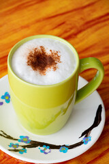 Cappuccino coffee Cup in the Table 