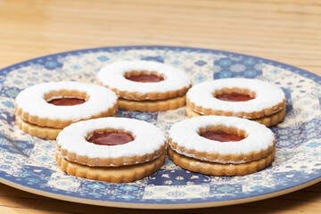 Homemade cookies with forest fruit jam and sugar glass