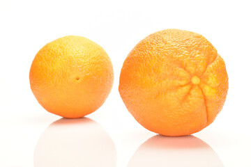 Ripe, organic orange, macro, on a white background.