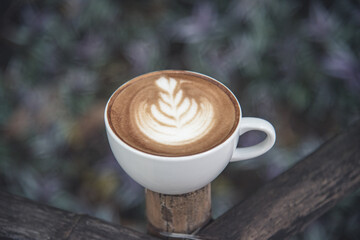 Organic Coffee In the nature. Put on a wooden table Under the tr