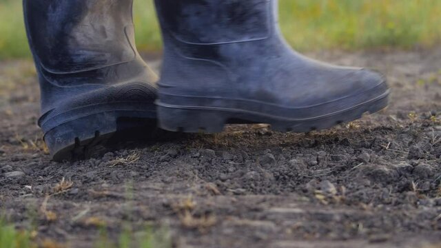 Farmer boot raise  earth slow motion