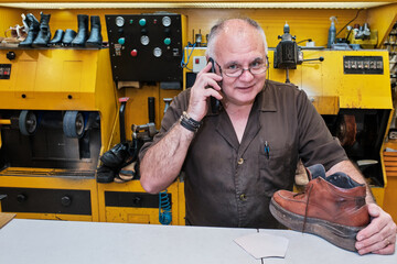 Shoemaker working on coronavirus days with mask