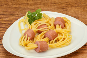 Kids pasta spaghetti with sausages
