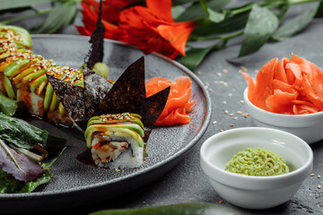 Japanese sushi -Green dragon. Avocado, onion, salmon and sushi cheese