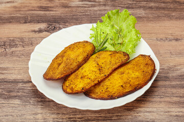 Baked potato with herbs and spices