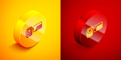 Isometric Cinema camera icon isolated on orange and red background. Video camera. Movie sign. Film projector. Circle button. Vector Illustration