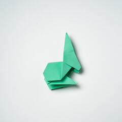 origami green hare on a white background