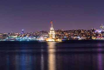 Fototapeta na wymiar Cityscape of historic Istanbul with the illuminated Maiden's/Leander's Tower and the skyline in the evening. Uskudar, Istanbul, Turkey 