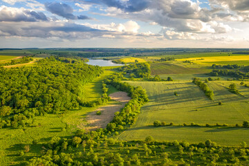 Obraz premium Aerial view from drone of beautiful fresh green countryside and at summer