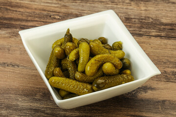 Pickled gherkin in the bowl