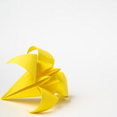 origami yellow iris on a white background