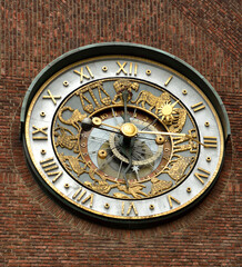 Fototapeta na wymiar Astronomical clock on northern side of City hall (Radhuset) in Oslo, Norway
