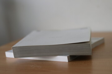 Books, Thick heavy books with white paper and hard cover, good binding, perfect binding, large number of pages, huge page booklet on table