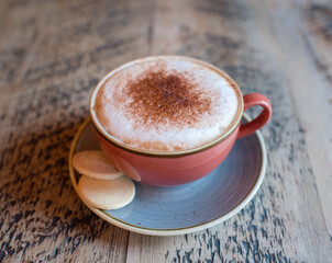 Coffee latte with chocolate and biscuit