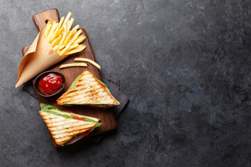 Club sandwich and potato fries chips